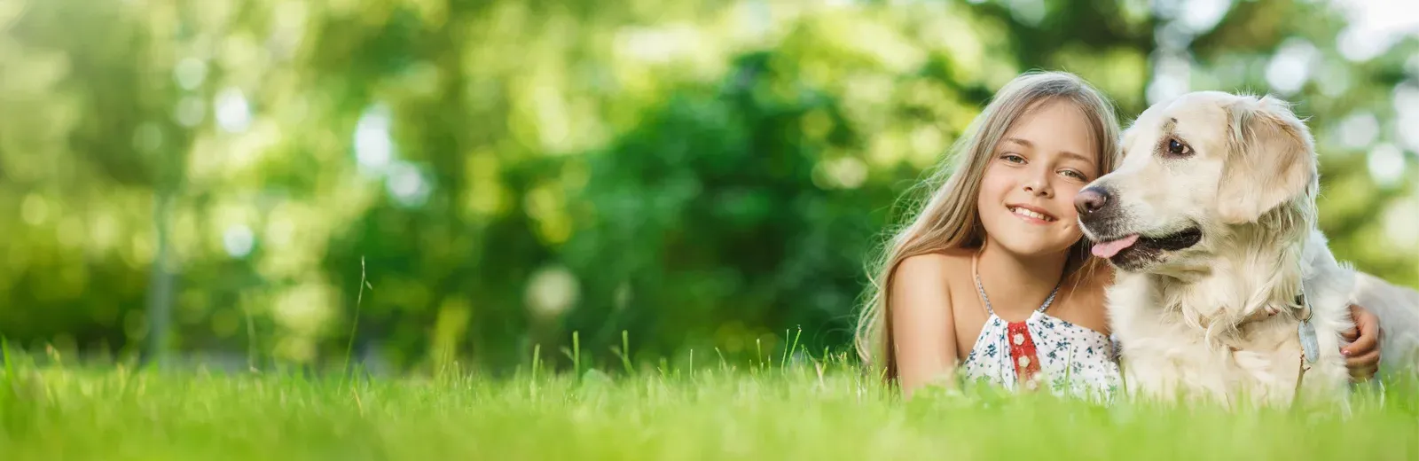 girl playing with dog outside